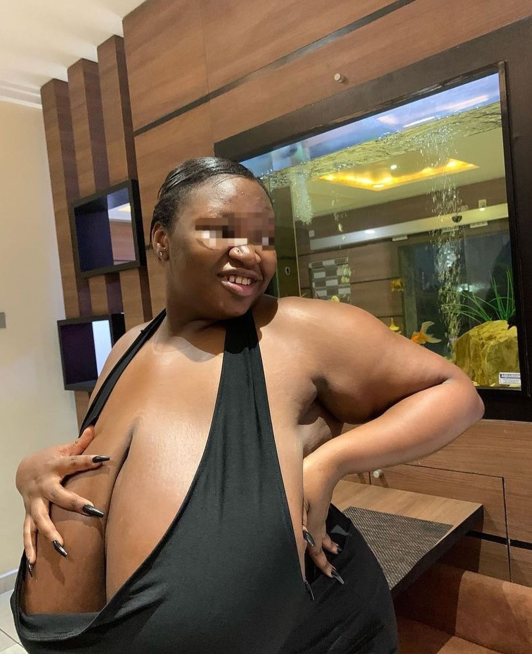 aniekan udoh share big boobs spill out photos